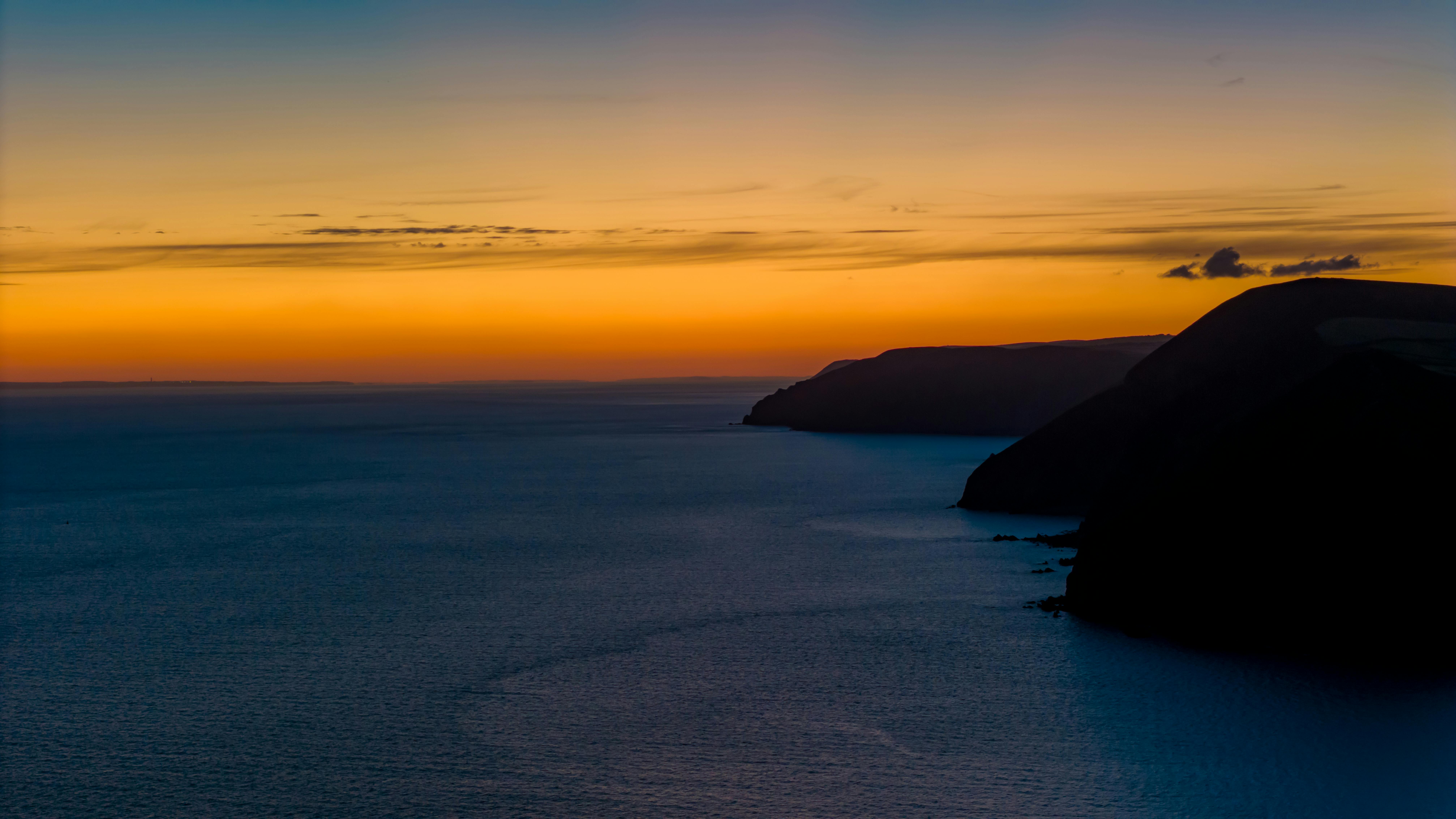 A breathtaking view of the sunrise over the Bristol Channel, capturing vivid colors and serene seascape.