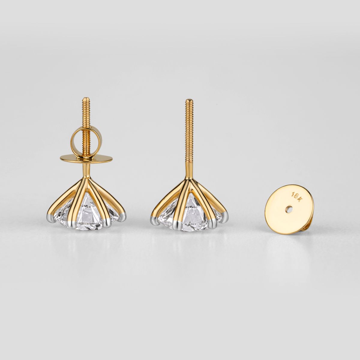 Gold and diamond stud earrings displayed as fine jewelry for everyday and special occasions