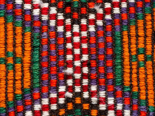Free Intricate close-up of a colorful woven textile showcasing vibrant traditional patterns. Stock Photo