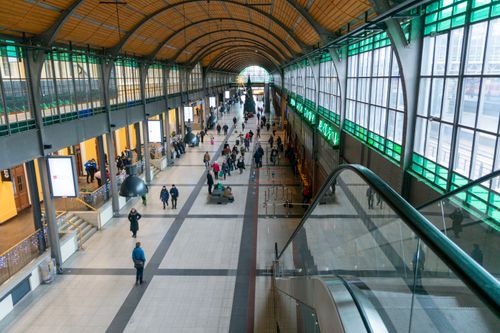 Free Wrocław train station interior with people and Christmas decorations. Stock Photo