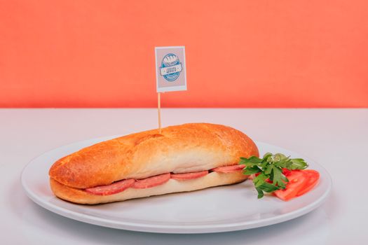 Tasty sandwich with parsley and tomato on a plate, perfect for lunch.