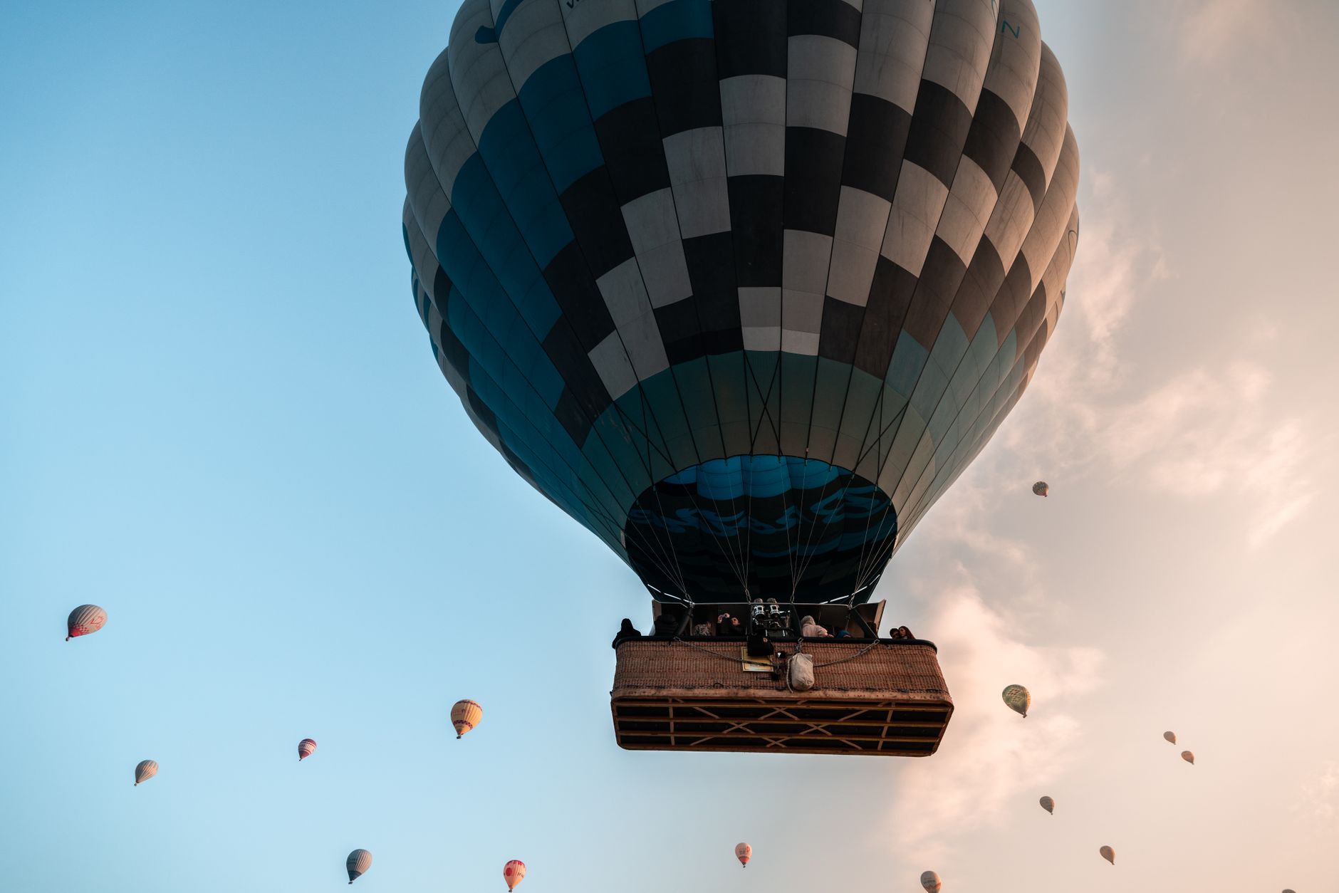giant inflatable games cairo — Hot air balloons soar against a blue sky, capturing the essence of adventure.