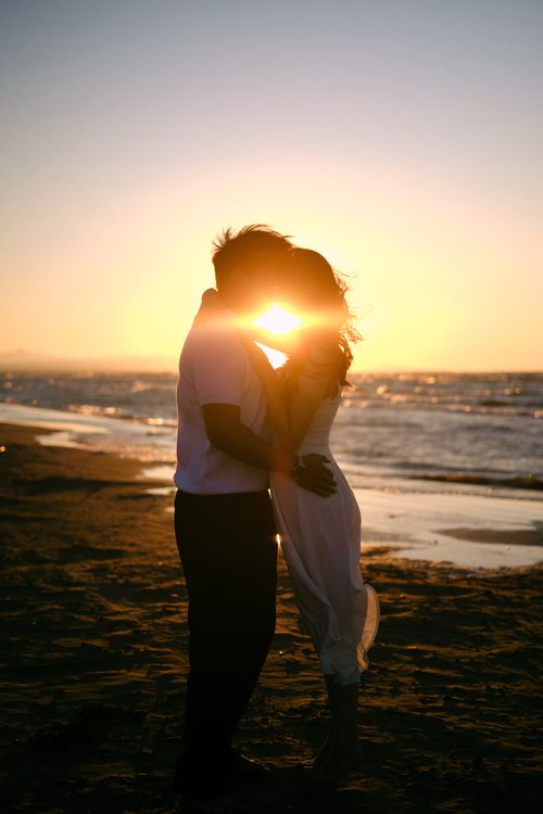 Romantic Sunset Beach Embrace Silhouette · Free Stock Photo