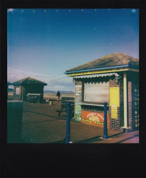 A quaint seaside donut stand captured in vintage Polaroid style, showcasing nostalgic charm.