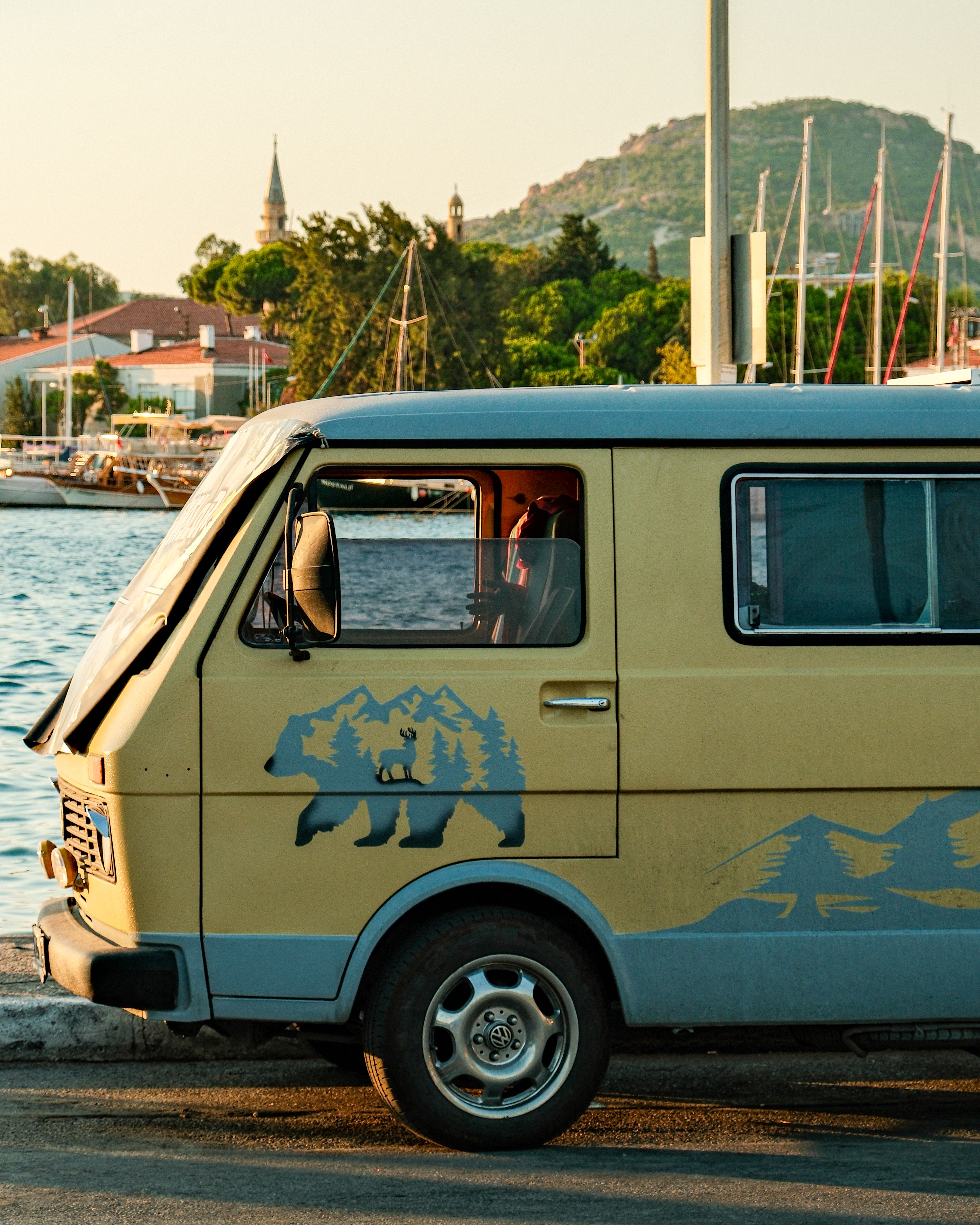 Retro Camper Van by Scenic Harbor at Sunset · Free Stock Photo