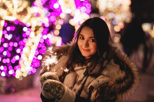 Bokeh Photography of Woman in Brown Parka Jacket
