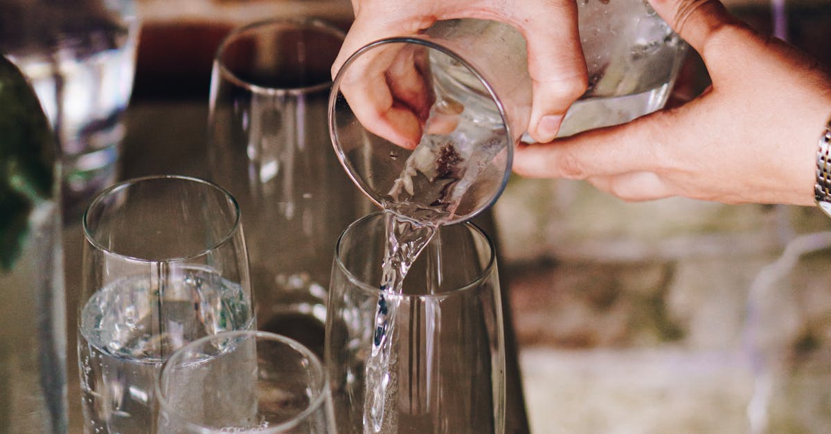 Person Pouring Liquid from Pitcher · Free Stock Photo