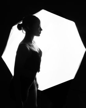 Backlit silhouette of a dancer in Mexico City highlighting grace and artistic expression.