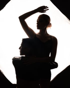 Silhouette of an elegant dance couple captured in Mexico City, showcasing artistic love.