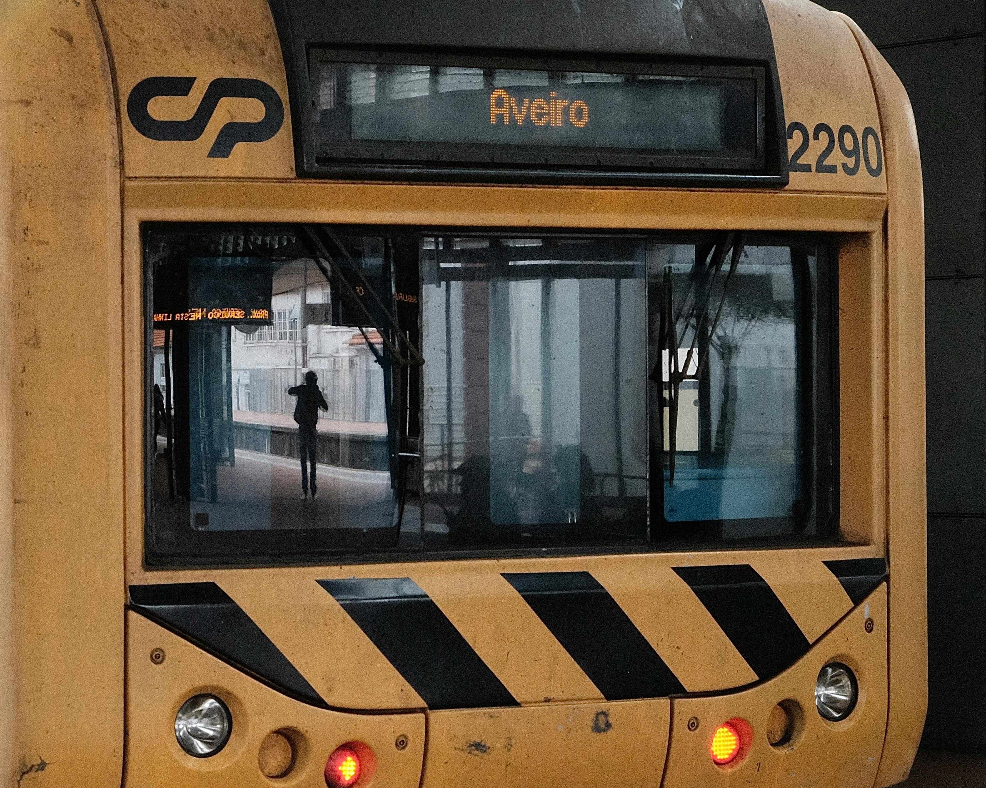 Yellow train at Aveiro station reflecting urban travel atmosphere.