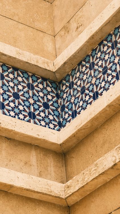 Geometric Tile Pattern on Beige Architectural Wall · Free Stock Photo