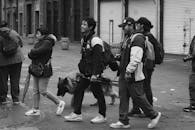 Urban Street Walk with Group and Dog in Black and White