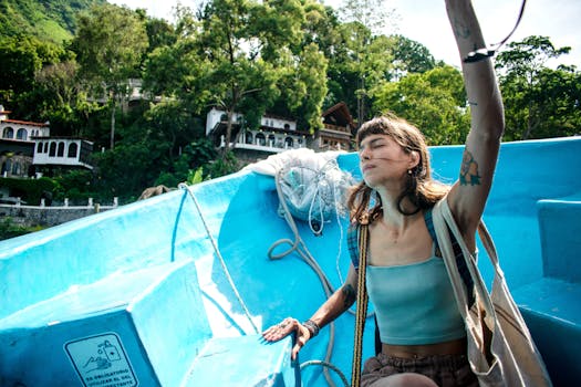 Woman enjoying a serene boat ride in Santiago Atitlán, surrounded by lush greenery.
