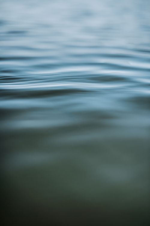 Free A tranquil close-up of rippling water, evoking calmness and serenity. Stock Photo