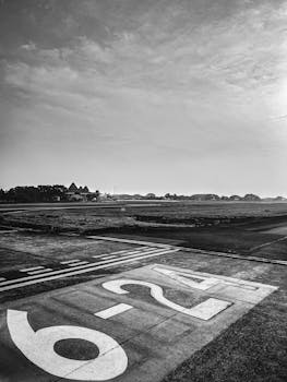 A monochrome view of a runway in East Jakarta, Indonesia showing direction numbers.