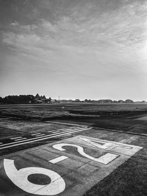 Free A monochrome view of a runway in East Jakarta, Indonesia showing direction numbers. Stock Photo