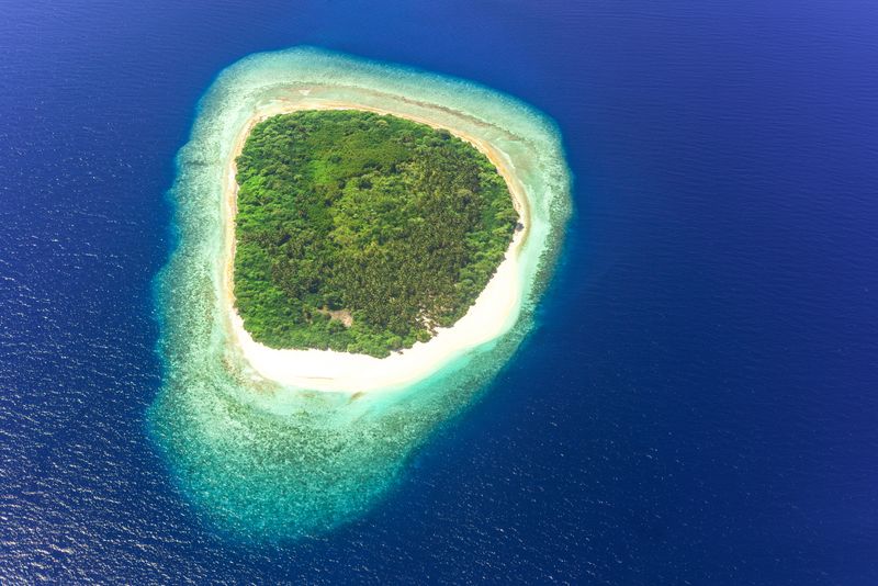 Aerial view of a tropical island with turquoise waters