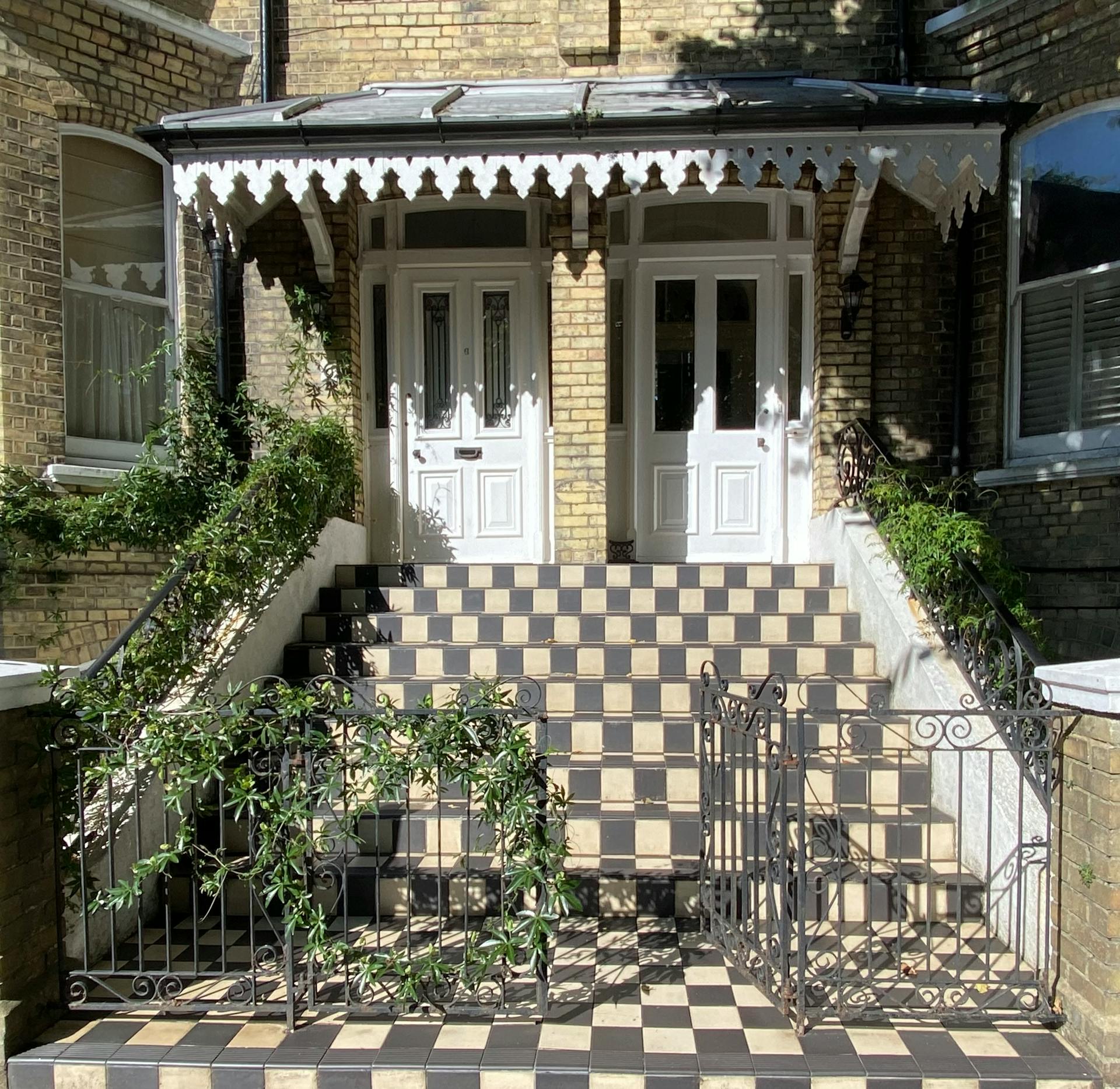 Charming Victorian Entrance with Checkered Steps