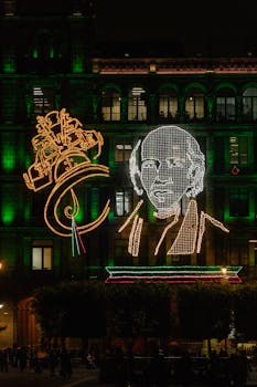 Vibrant light display at Mexico City's Zocalo celebrating Mexican Independence Day at night.