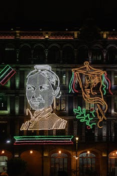 A mesmerizing LED light display in Mexico City celebrates Mexican Independence Day with vibrant colors and iconic figures.