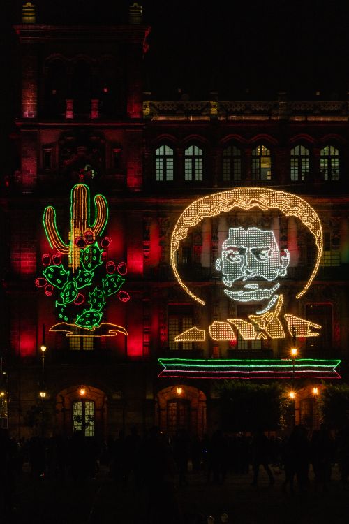 Free Colorful LED lights on a historic building in Mexico City, celebrating Mexican Independence Day. Stock Photo