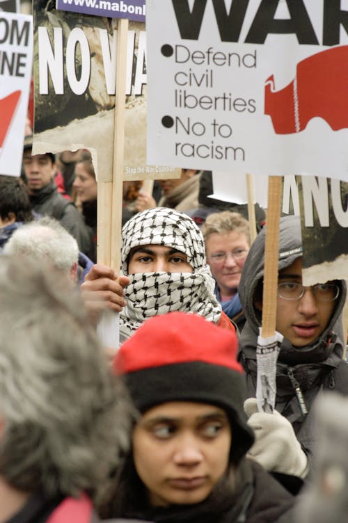 Anti-War Protest Sign at Baltimore Rally · Free Stock Photo