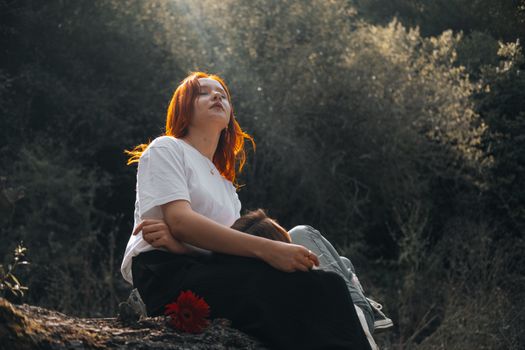 Two friends relax among trees in Merzifon, capturing autumn's serene ambiance.