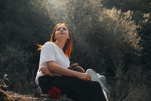 Two women enjoying a serene moment in an autumn forest in Merzifon, Türkiye.
