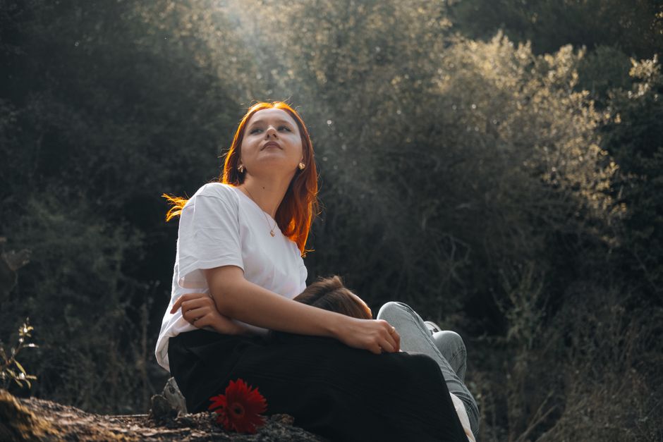Two women enjoying a serene moment in an autumn forest in Merzifon, Türkiye.