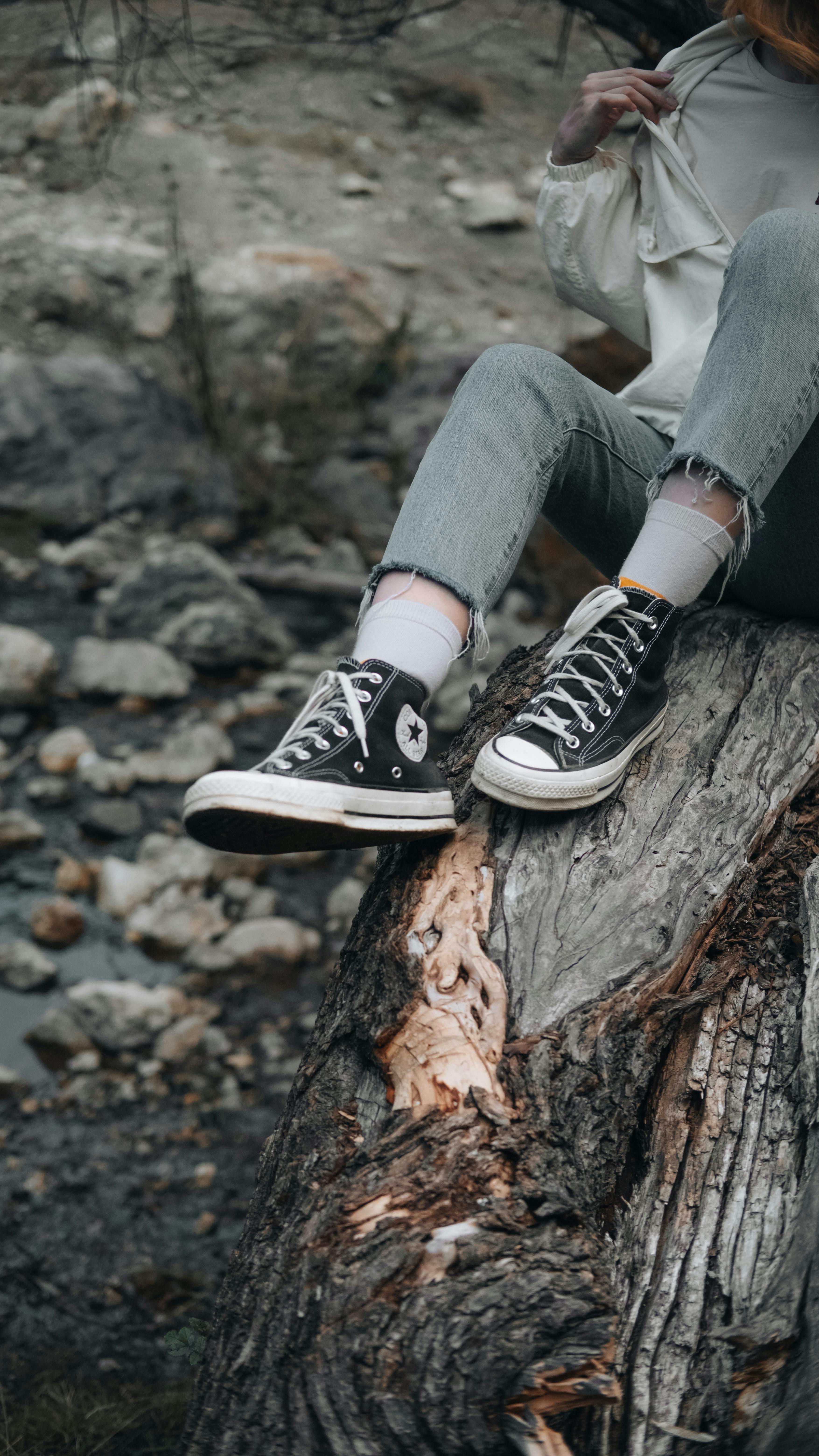 trendy teenager relaxing in natural autumn setting