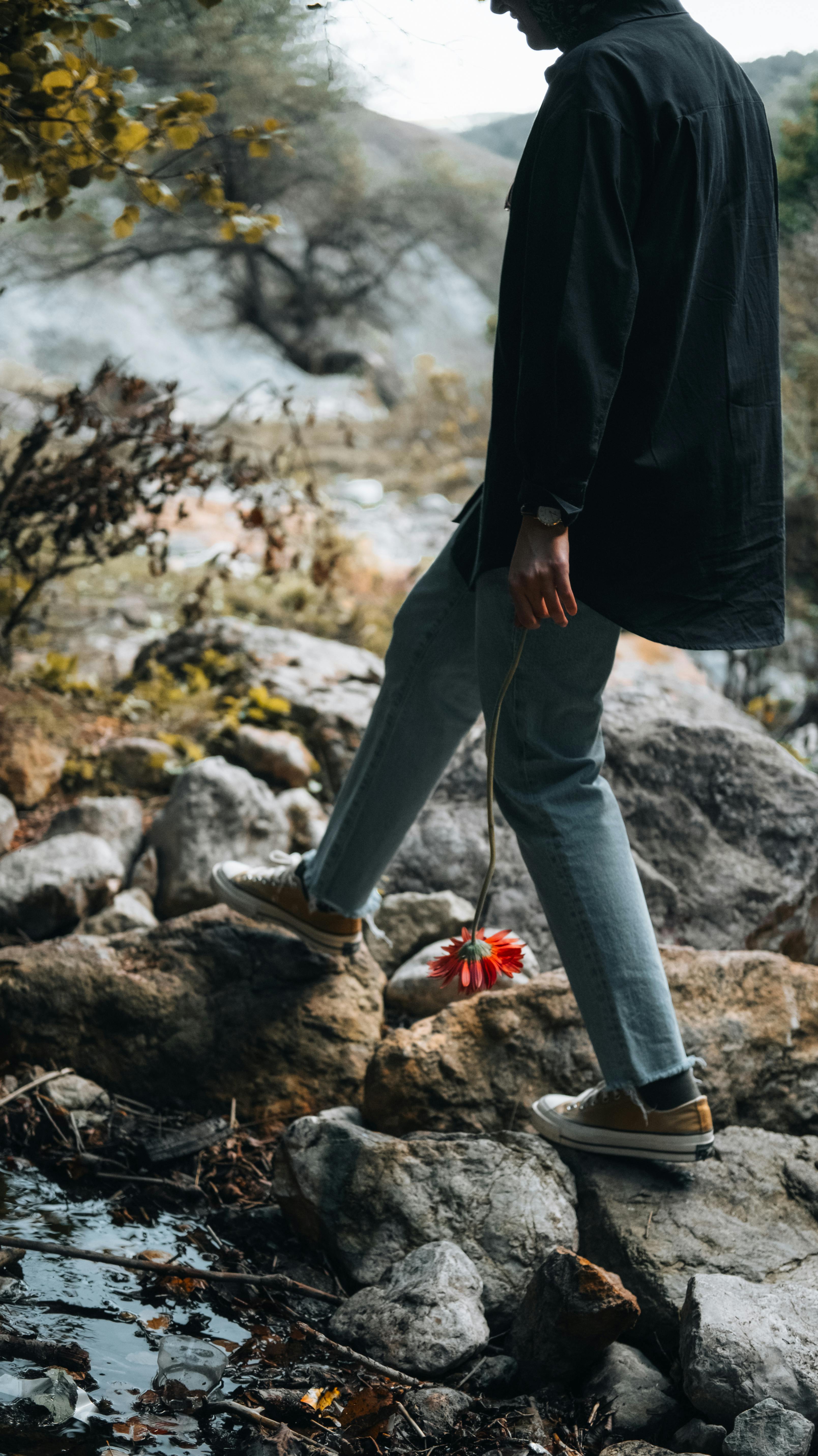 contemplative walk among autumn rocks