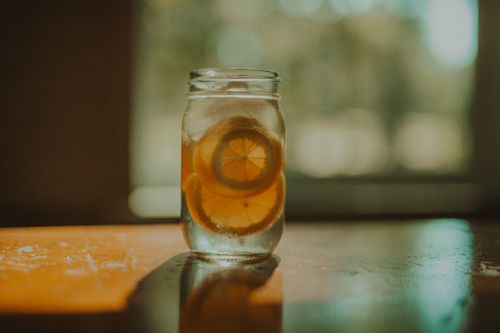 Free Aesthetic shot of lemon water in a mason jar with natural window light in Fairhope, AL. Stock Photo