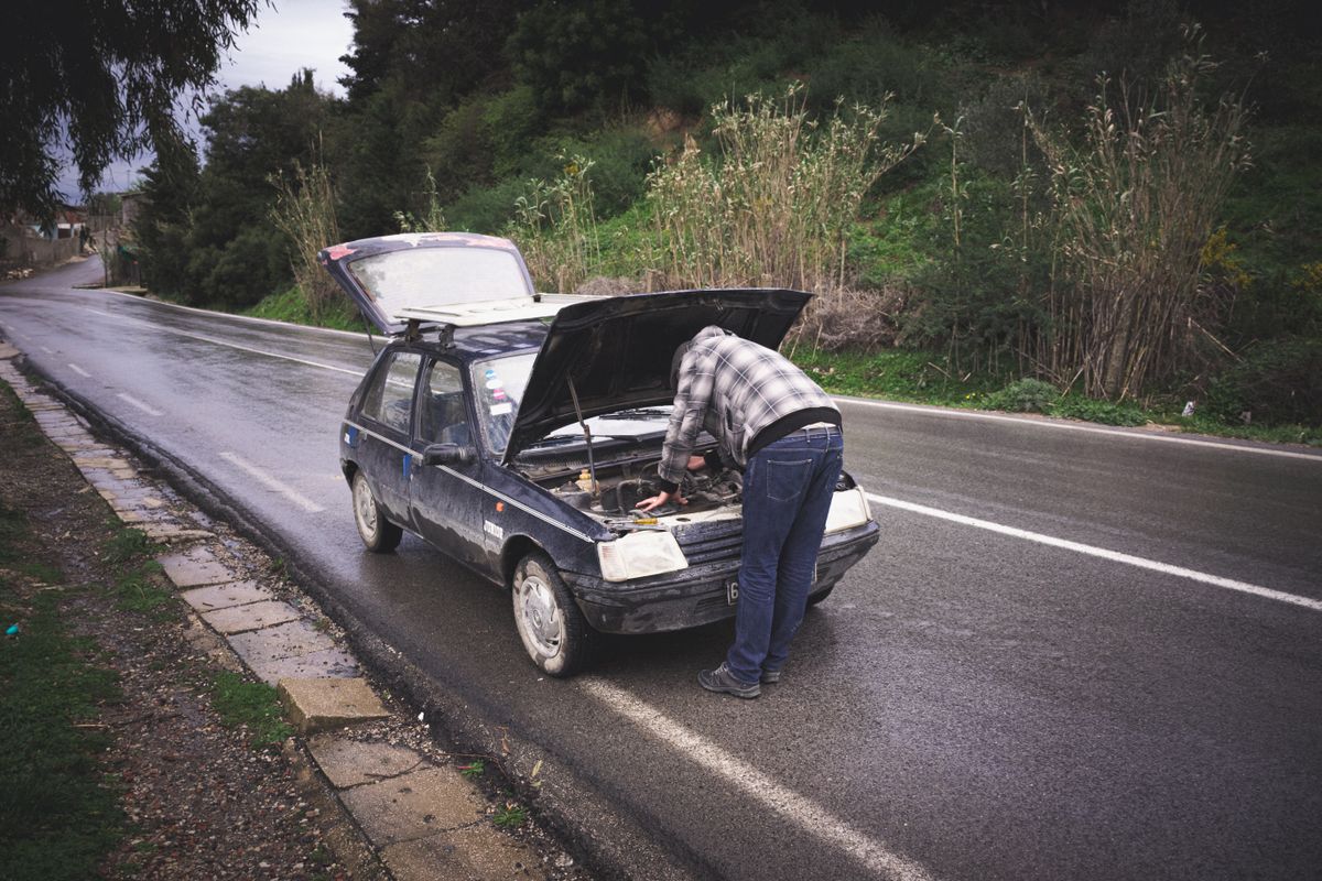 Roadside assistance boosting a car battery in Grimsby