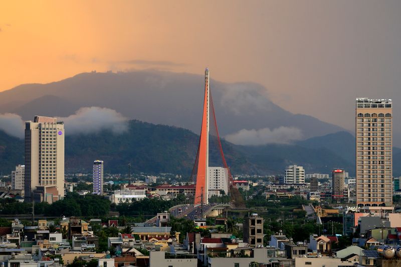 Sunset cityscape with a cable-stayed bridge over the Han River in Da Nang