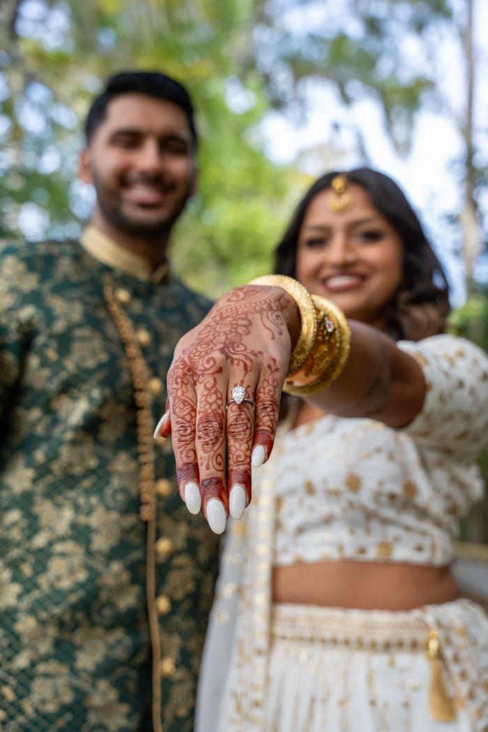 Engagement ring on a hand with mehendi