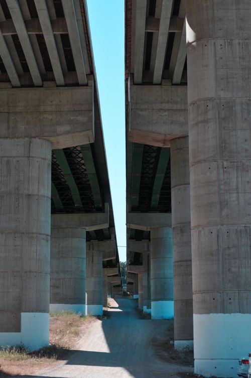 Free Concrete highway bridges captured from below, showcasing structural design. Stock Photo