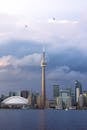Toronto Skyline with CN Tower under Cloudy Sky