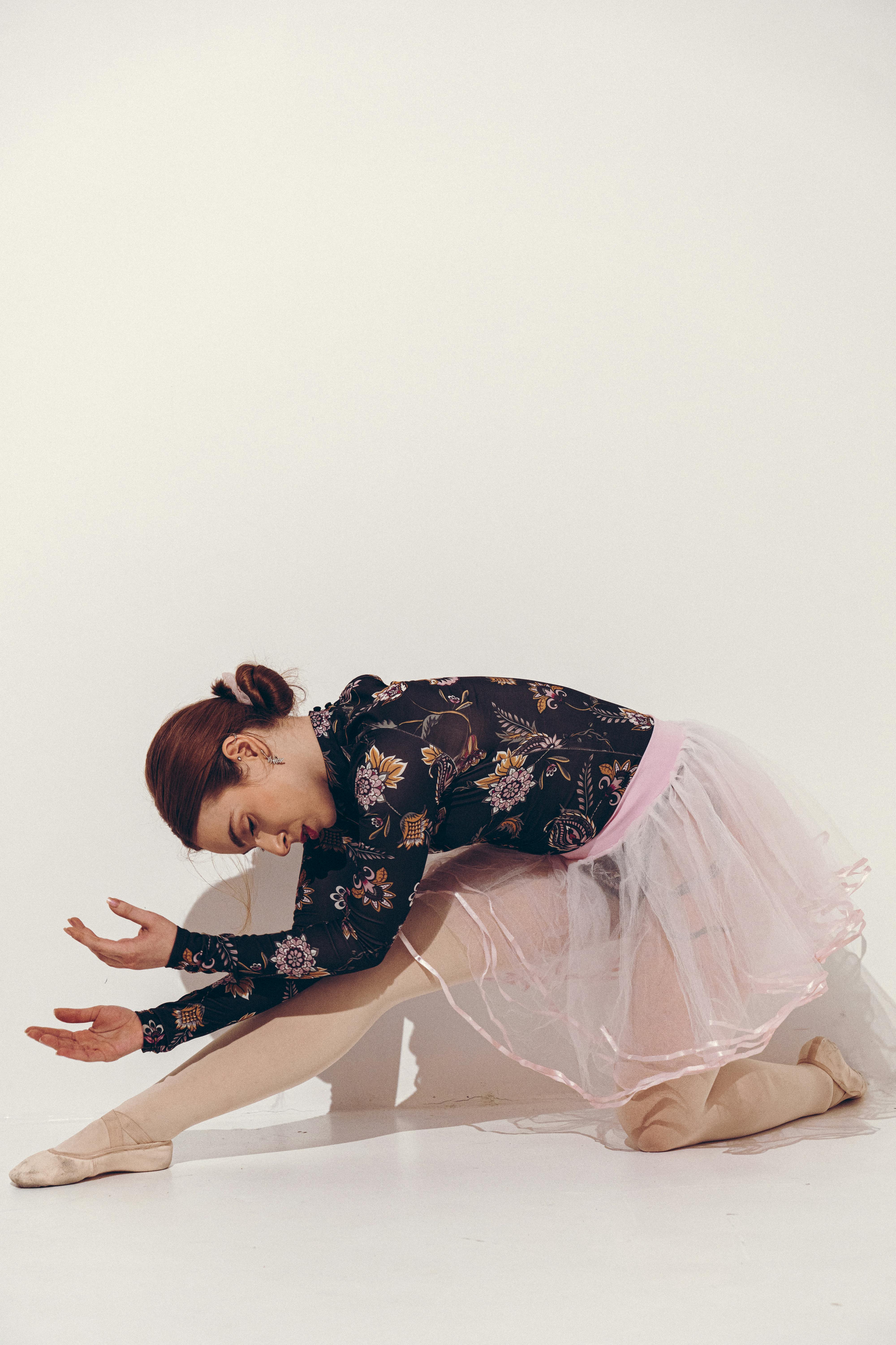 Elegant Ballerina in Pink Tulle Skirt Posing Gracefully · Free