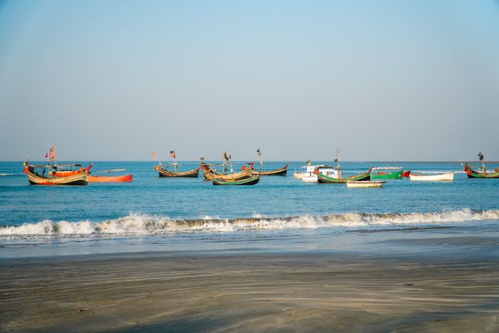 Tropical beach with fishing boats