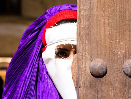 A woman's eye peers through a traditional veil in Yazd, Iran.