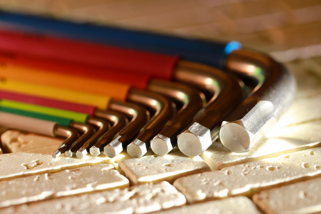 Colorful Hex Key Set on Textured Surface · Free Stock Photo