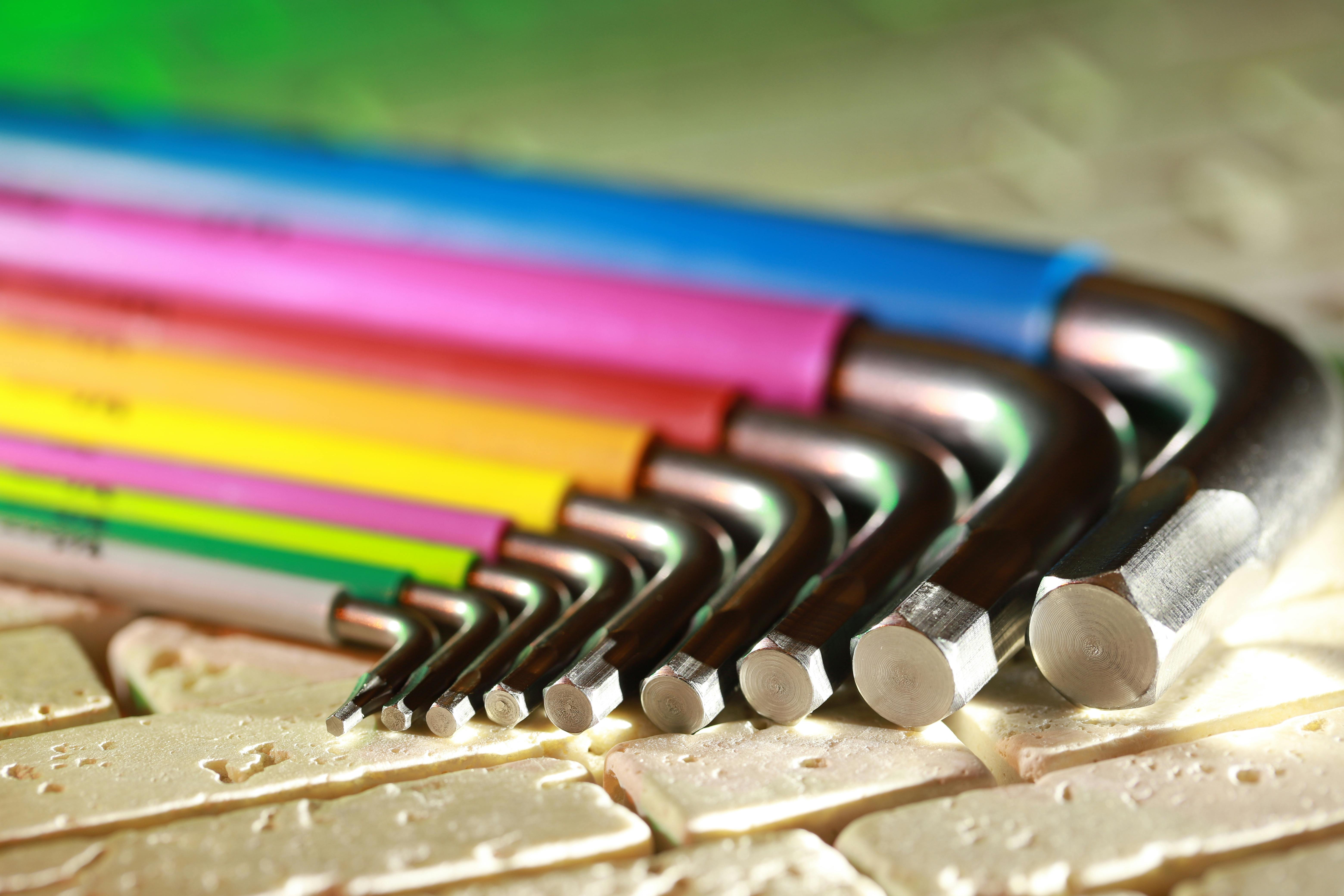 colorful allen wrenches on textured surface