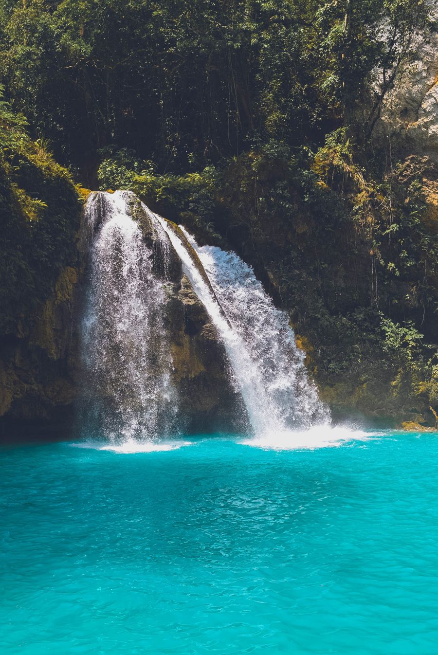 Stunning waterfall with clear blue pool