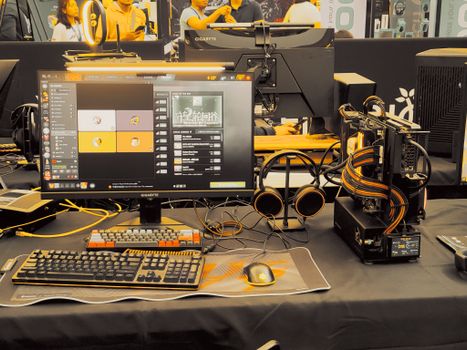 Modern gaming gear setup on display at a tech expo.