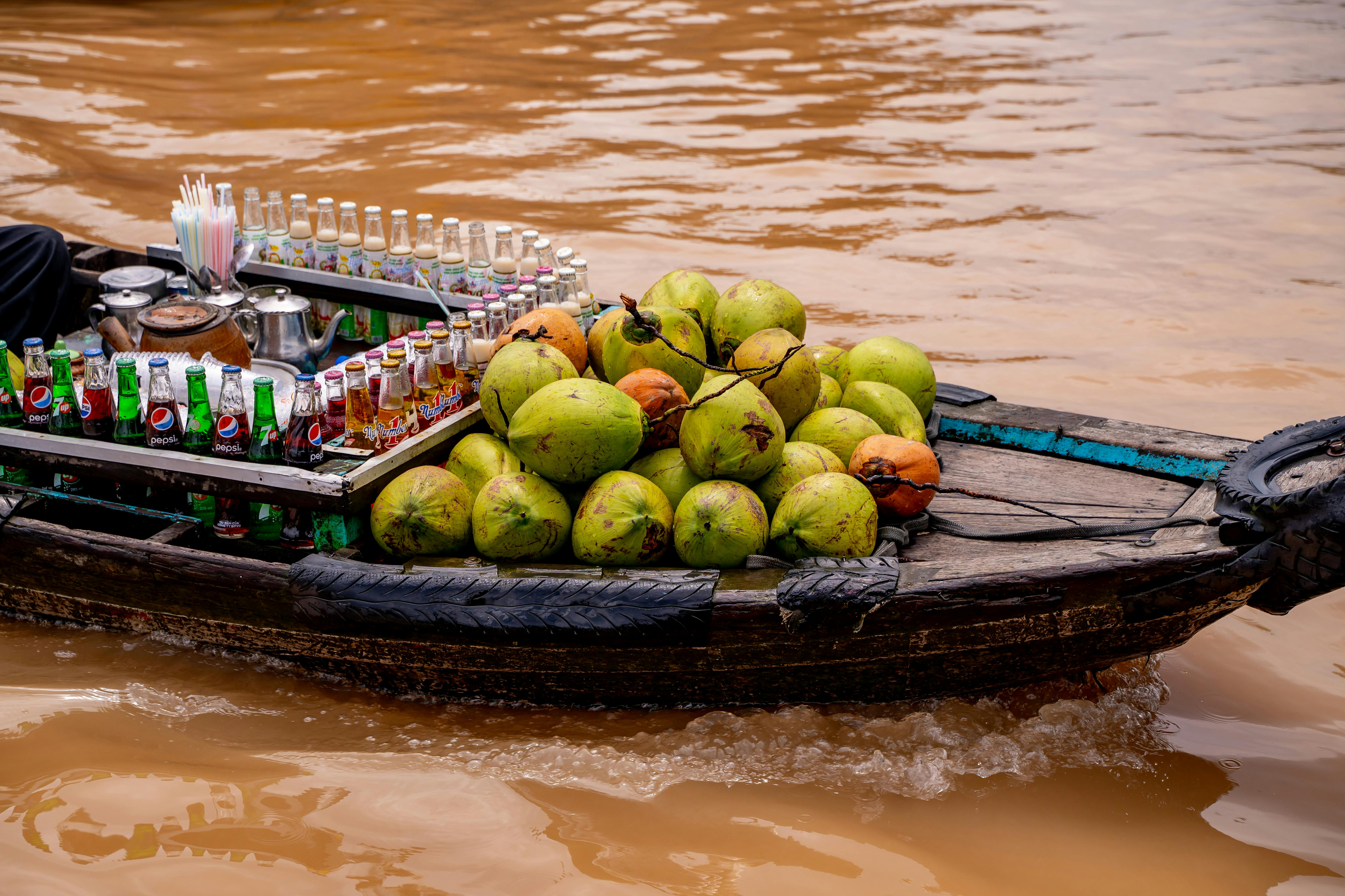A boat selling coconuts and drinks at the floating market in Cần Thơ, Vietnam.