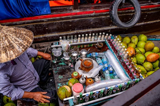 Colorful display of beverages and coconuts at Cần Thơ floating market, Vietnam.
