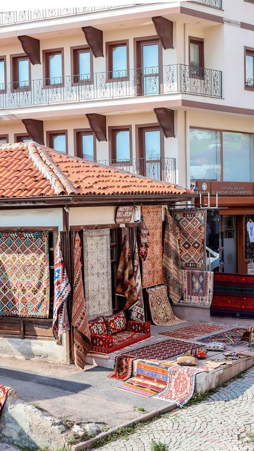 Free Vibrant outdoor market showcasing an array of traditional rugs on display. Stock Photo