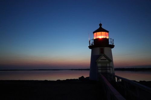 Free A serene view of Brant Point Lighthouse at twilight on Nantucket Island, Massachusetts. Stock Photo