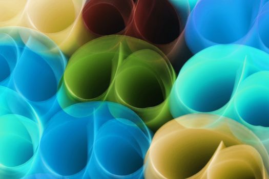 A vibrant abstract image showcasing rolled paper tubes with a variety of colors and overlapping textures.