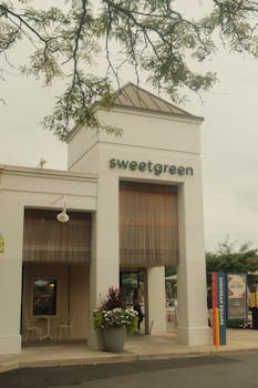 Sweetgreen restaurant exterior with modern architecture and outdoor seating.